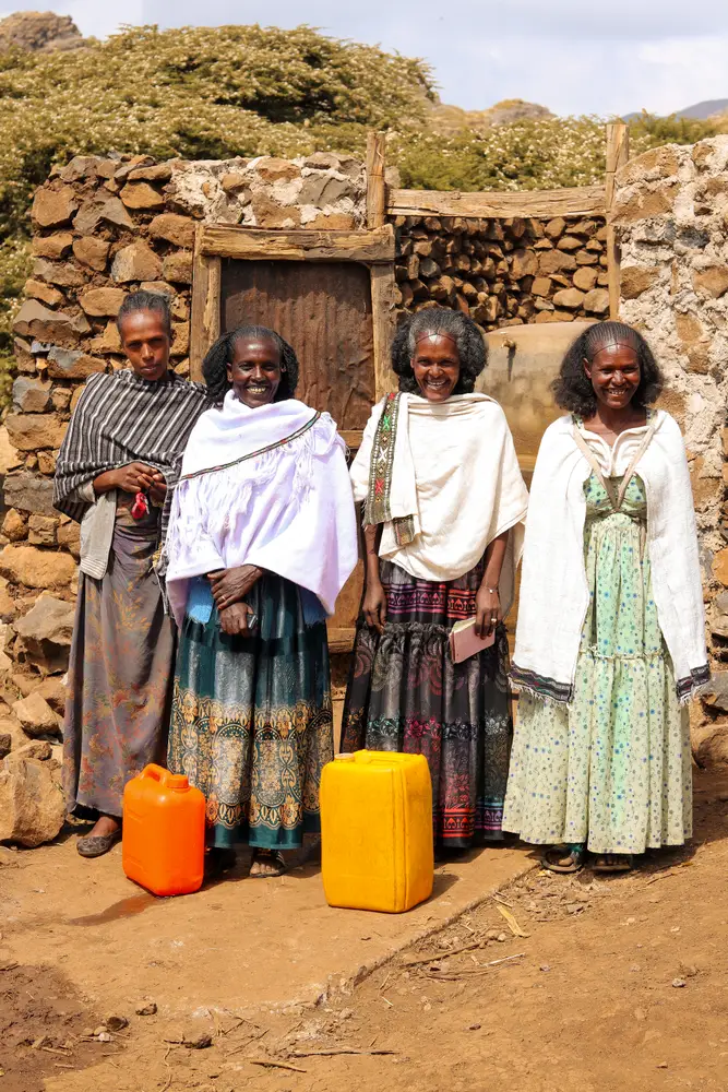 Members of a women-led water committee in Emba Alaje, Tigray, with their water containers